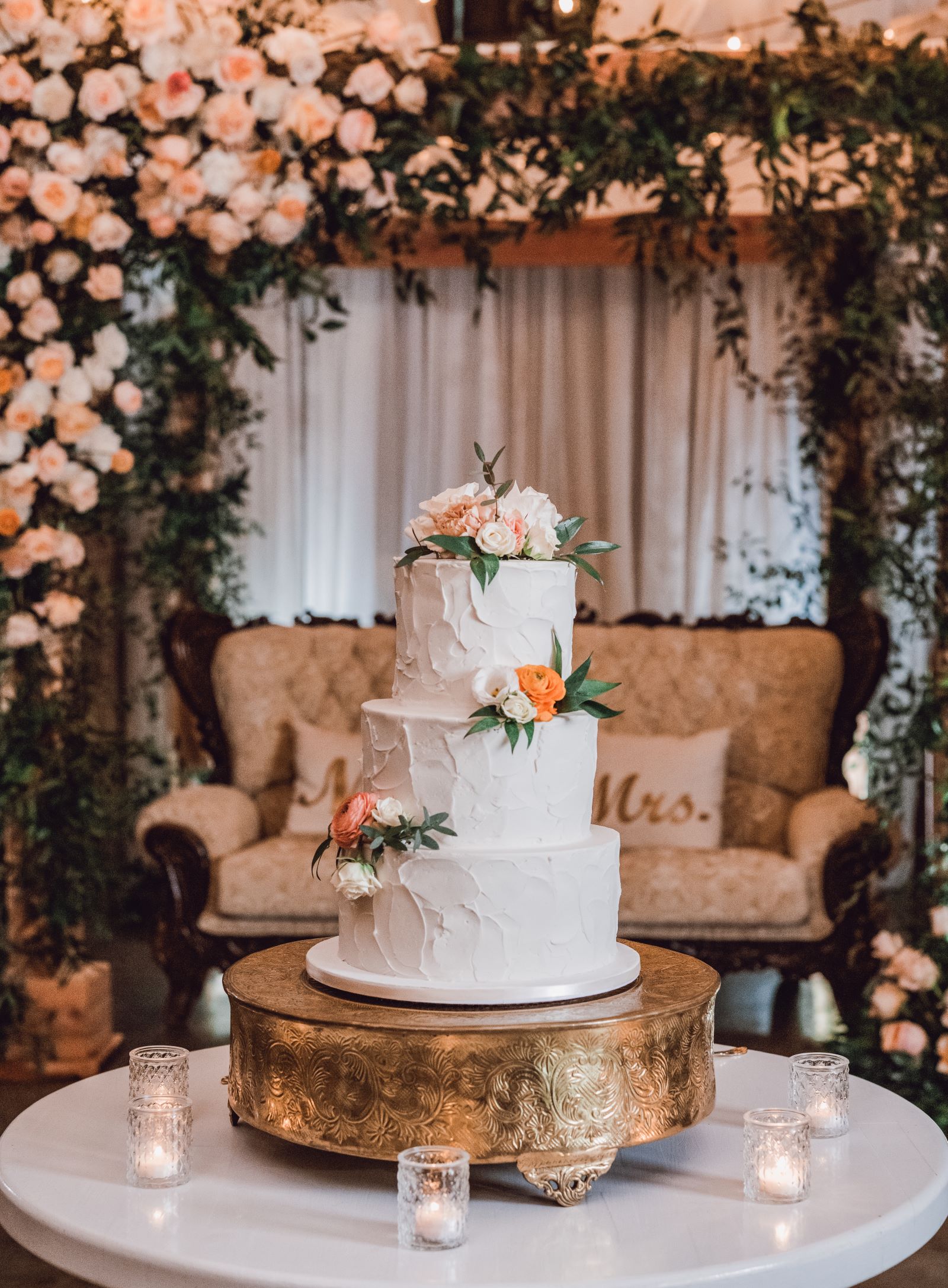smiling bridesmaids are outside and holding flowers